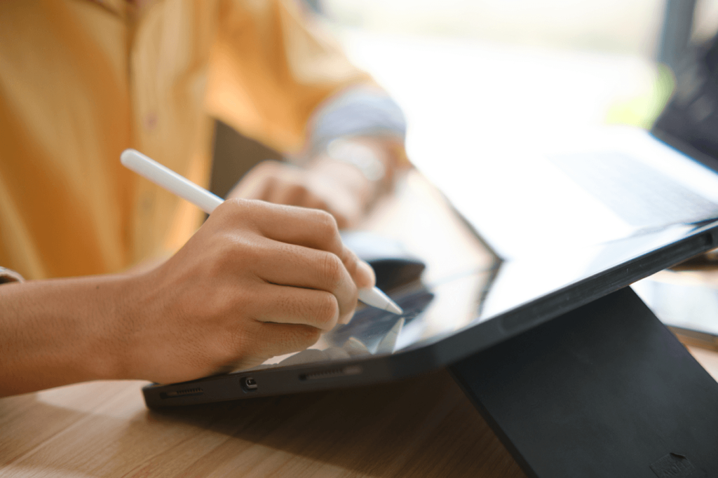 Woman signs a document digitally.